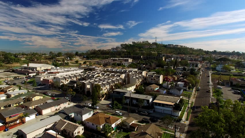 Aerial Panning Beautiful View Of Roofed Houses In City On Sunny Day - Long Beach, California