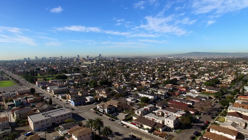 Aerial Upward Shot Of Residential Roofed Houses On City Landscape During Sunny Day - Long Beach, California