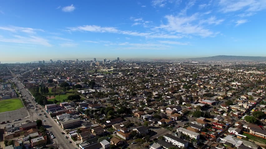 Aerial Shot Of Residential House And Buildings In City, Drone Flying Forward On Sunny Day - Long Beach, California