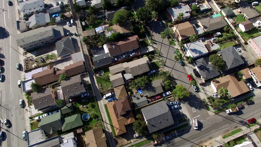 Aerial Forward Beautiful Shot Of Residential Roofed Houses On Sunny Day - Long Beach, California