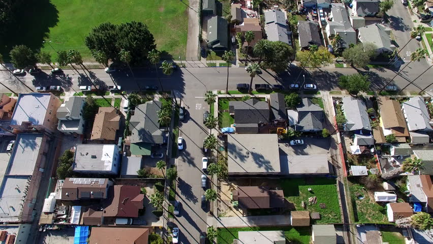 Aerial Backward Tilt Up Beautiful View Of Houses In City On Sunny Day - Long Beach, California