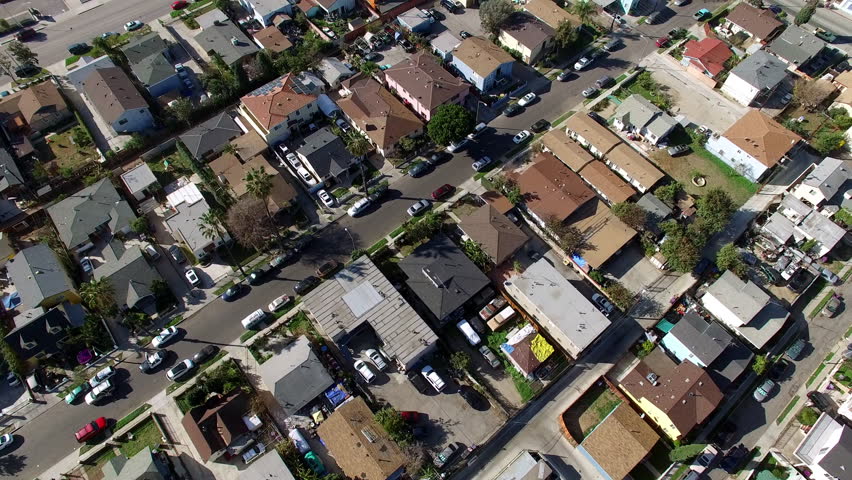 Aerial Tilt Up Shot Of Residential Roofed Houses On City Landscape During Sunny Day - Long Beach, California