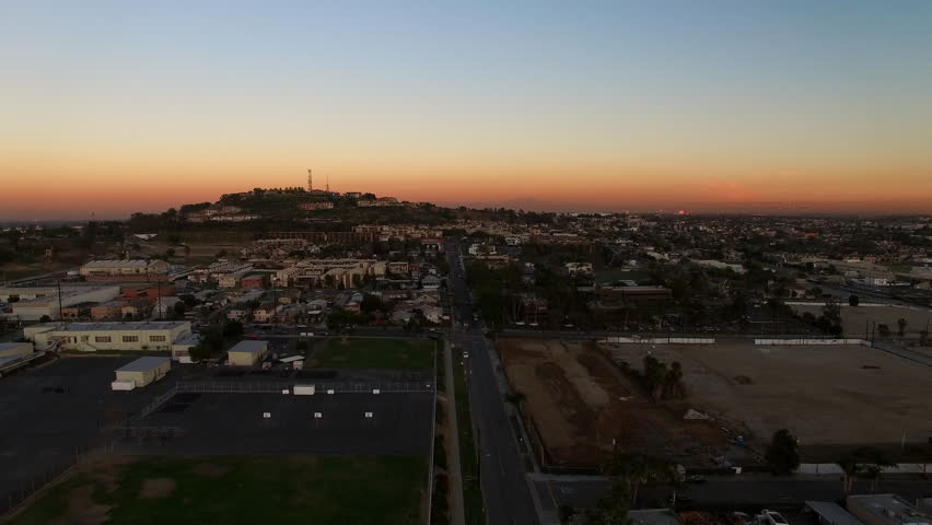 Aerial Scenic View Of Buildings In Residential City, Drone Flying Forward During Sunset - Long Beach, California