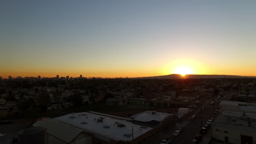 Aerial Upward Scenic View Of Residential Structures In City Against Clear Sky At Sunset - Long Beach, California