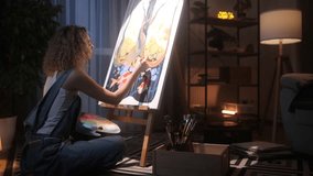 Beautiful Blonde Curly-Haired Female Painter. A Young Talented Artist wearing Headphones Draws a Picture and Enjoys Music while Sitting on the Floor in her Cozy Home Studio - Powered by Shutterstock - Get 15% off with code: PIKWIZARD15