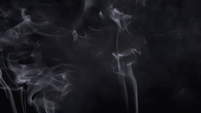Thin Curls of White Smoke Rise Up, Filling Empty Space. Black Background. Incense sticks. Smog. Abstract shapes. Mist. Texture. Clouds. Smoke swirl. Floating fog, flowing smoke. Blurred motion. Light. - Powered by Shutterstock - Get 15% off with code: PIKWIZARD15