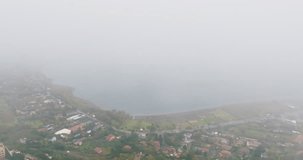 Aerial view of Lake Albano in Italy. Mystical panoramic video of the nature landscape of the lake, mountain ranges and cities on them. High quality 4k footage