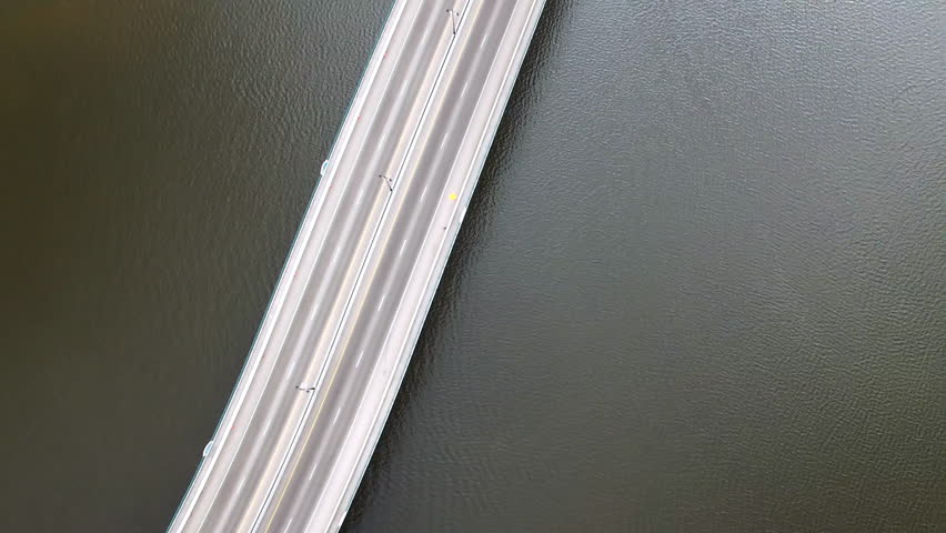 Aerial Tilt Up Scenic View Of Broadway Bridge Over Rippled River In Residential City - Daytona Beach , Florida