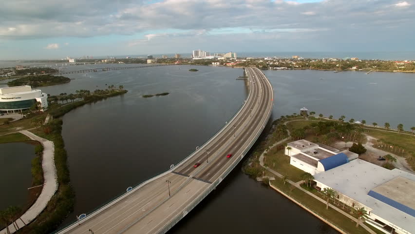 Aerial Panning Scenic View Of Cars On Broadway Bridge Over Tranquil Halifax River - Daytona Beach , Florida