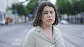 Young beautiful hispanic woman smiling confident standing in the streets of Vienna - Powered by Shutterstock - Get 15% off with code: PIKWIZARD15