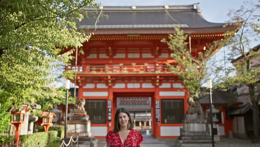 Cheerful beautiful hispanic woman, enjoying the joy of standing smiling at the ancient yasaka temple, kyoto, a casual brunette, emotion shining in her successful, confident expression Royalty-Free Stock Footage #3443166271