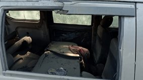 Abandoned Grey car with damaged paint and broken windows showing interior overgrown with vegetation depicting neglect and decay old accident scrap car asia india - Powered by Shutterstock - Get 15% off with code: PIKWIZARD15