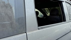 Abandoned Grey car with damaged paint and broken windows overgrown with vegetation depicting neglect and decay old accident scrap car asia india - Powered by Shutterstock - Get 15% off with code: PIKWIZARD15