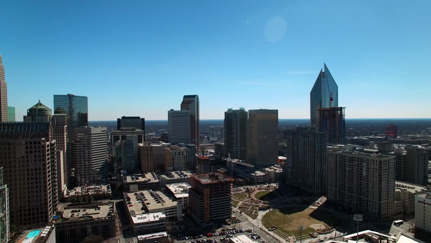Aerial Backward Shot Of Modern Office Towers In Financial District On Sunny Day - Charlotte, North Carolina