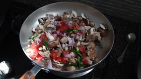 Chef stirs mushrooms fried in a hot pan. Food on cuisine. Healthy nutrition in gourmet kitchen. Making meal. Prepare food to eat. Delicious dish. Cooking eating. Home restaurant 4k video clip