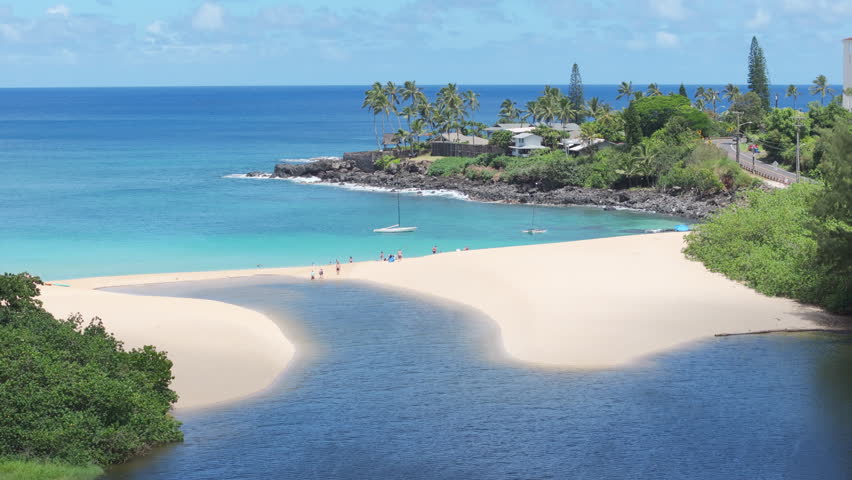 People enjoy vacation on beautiful sandy beach. Scenic nature landscape of Hawaii island. Waimea Valley panorama on Oahu North shore USA travel. Cinematic aerial Waimea Bay Beach on sunny summer day