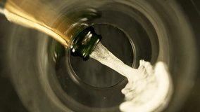 Super Slow Motion of Pouring Champagne Wine into Glass. Unique Perspective of View from Glass Bottom. Filmed on High Speed Cinema Camera, 1000 fps. - Powered by Shutterstock - Get 15% off with code: PIKWIZARD15
