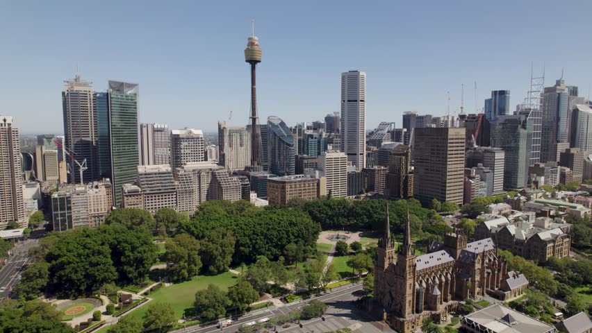 Flying towards Sydney city with Sydney Harbour Bridge Sydney Opera House St Marys Cathedral Hyde Park and Centerpoint tower Royalty-Free Stock Footage #3443421953