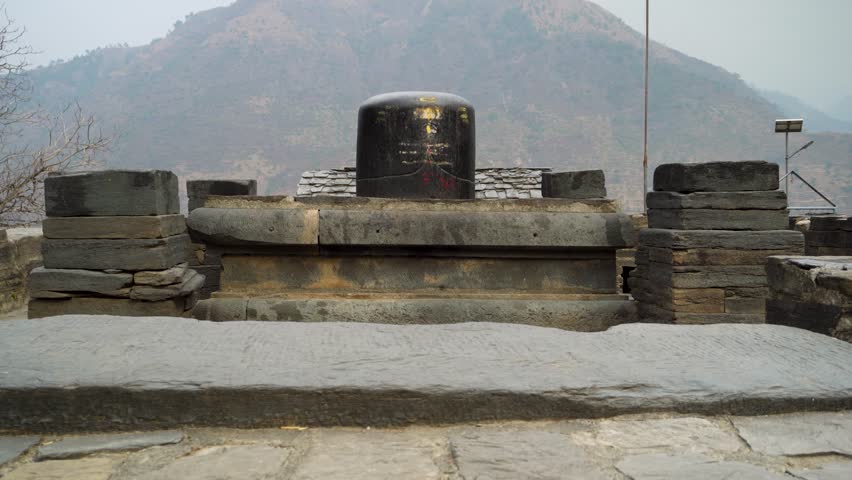 Feb.18th 2024, Uttarakhand India. Big Shiva Linga Sculpture: Lakhamandal Temple, Himalayan Mountains Background