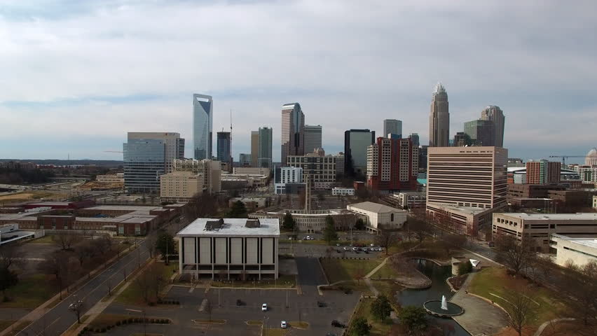 Aerial Upward Shot Of Downtown District In Residential City Under Cloudy Sky - Charlotte, North Carolina