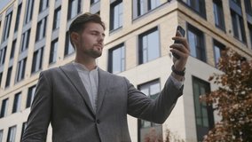 Businessman Speaking on Video Call Using Smartphone