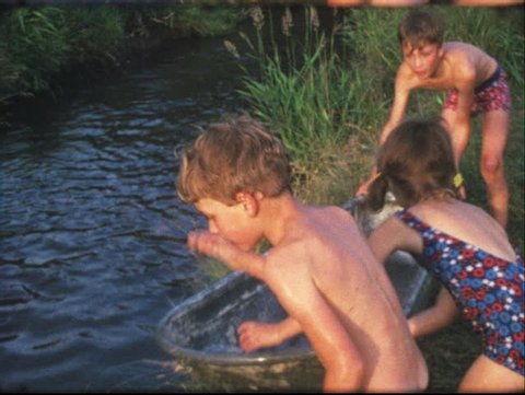Vintage 8mm film: Children in bathtub on pond, 1960s