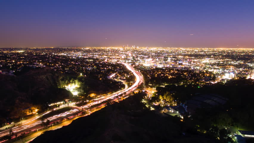 Aerial Lockdown Time Lapse Shot Of Long Exposure Of Illuminated Vehicles Moving On Road In City At Night - Los Angeles, California