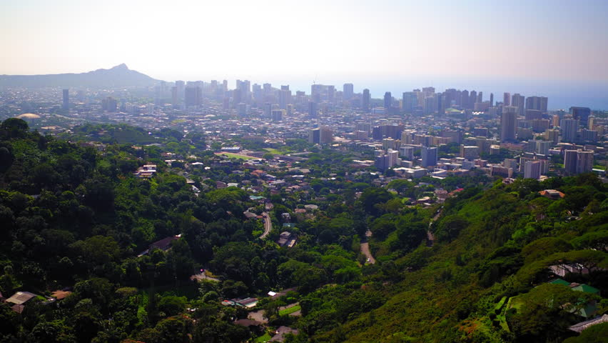 Aerial Backward Beautiful Shot Of Residential City On Island Against Clear Sky - Honolulu, Hawaii