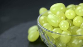 Some fresh harvested green Grapes rotating on a plate (not loopable; 4K)