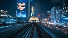 Motion timelapse POV shot from modern Dubai Metro running alongside the Sheikh Zayed Road at night in Dubai, United Arab Emirates (UAE).  - Powered by Shutterstock - Get 15% off with code: PIKWIZARD15