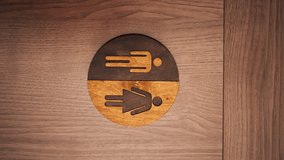 vertical video close up in a professional kitchen of a wooden toilet door with a round defining icon