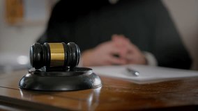 close up footage of Judge's hand with wooden judge gavel. Slow motion footage - Powered by Shutterstock - Get 15% off with code: PIKWIZARD15