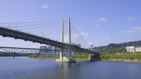 A 4k slow motion video from a boat as it passes under Tilikum Crossing Bridge which passes over the Willamette River in Portland Oregon.