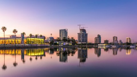 St. Petersburg, Florida, USA downtown city skyline on the bay from day to night.