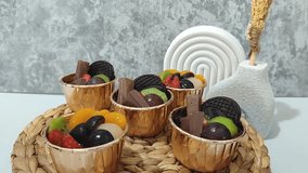 Pudding dessert. Various fruit pudding desserts decorated with mint and chocolate in a cup - Powered by Shutterstock - Get 15% off with code: PIKWIZARD15