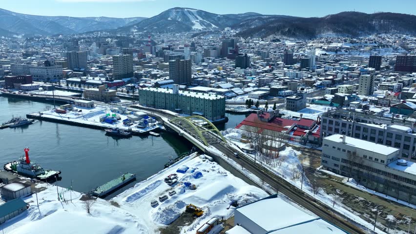 touristic town of Otaru in Hokkaido, Japan, in winter. Drone view of Otaru seaport in Japan, Tourism in Hokkaido in winter. High quality 4k footage
