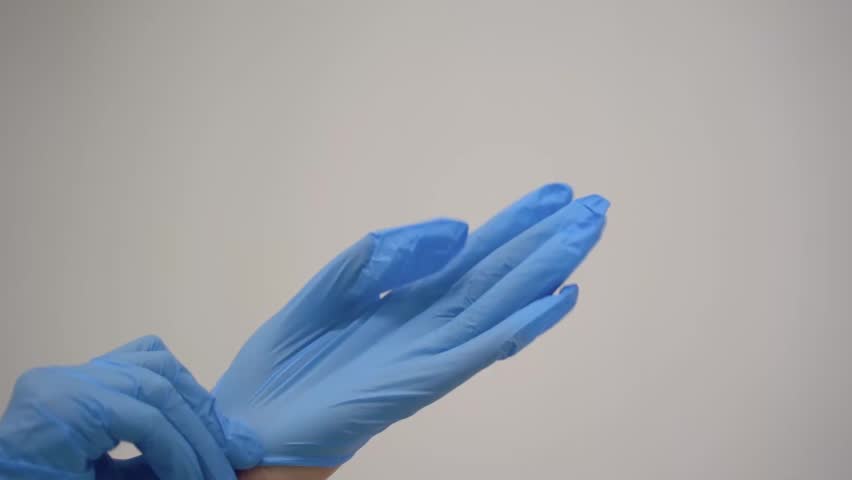 Close Up Of Hands Of Doctor Putting On Medical Gloves Royalty-Free Stock Footage #3444135947