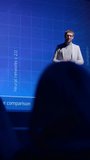 Live Event Stage: Speaker Presents New Product, Screen SHows Neural Networks, Artificial Intelligence, Big Data and Machine Learning. Video with Vertical Screen Orientation 9:16