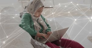 Animation of network of connections over biracial woman in hijab using computer. Global data processing, computing and digital interface concept digitally generated video.