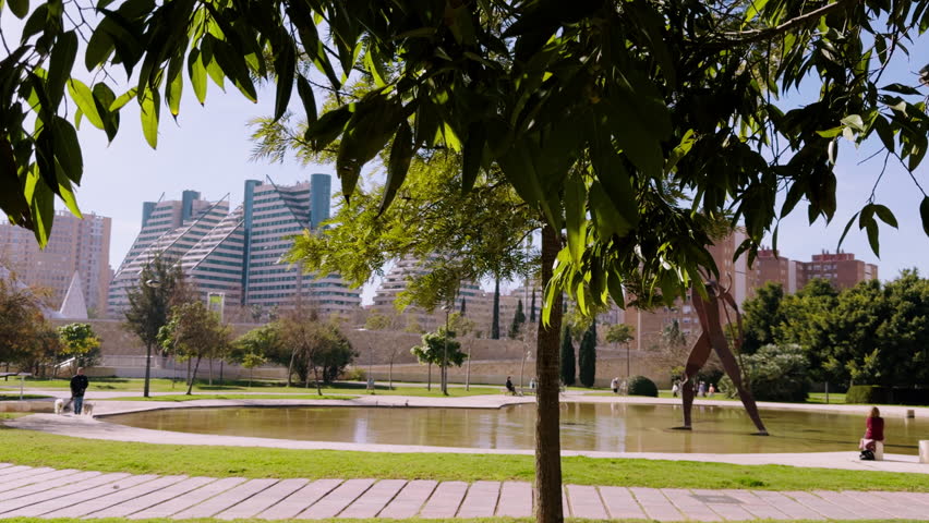 Walk through the green Turia Park in Valencia. A sunny warm day in mid-February in Spain. A popular place for active recreation.
