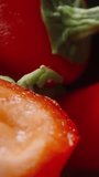 Chopped sweet red pepper. Dolly slider extreme close-up. Vertical video Social Media