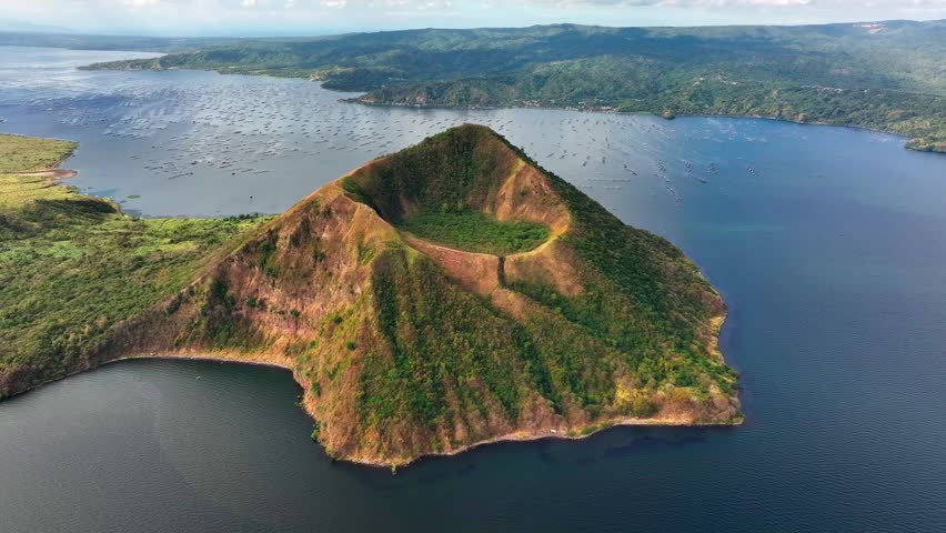 Aerial approaching shot of famous taal volcano at taal lake in Philippines, Batangas Province, South Manila,Tagaytay village.