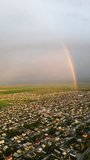 Aerial vertical view of rainbow over the city - Powered by Shutterstock - Get 15% off with code: PIKWIZARD15