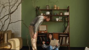 love couple have romantic leisure at home. young man and woman listen music on record player. girl sit on floor and give boyfriend a record - Powered by Shutterstock - Get 15% off with code: PIKWIZARD15