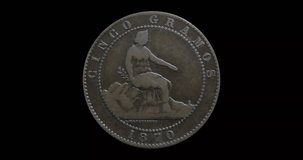 Obverse of Spain coin 5 centimos 1870, isolated in black background. Seamless animation in 4k resolution video.