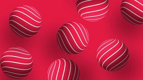 red balls with white stripes move chaotically on a black background. 4k video for your project.