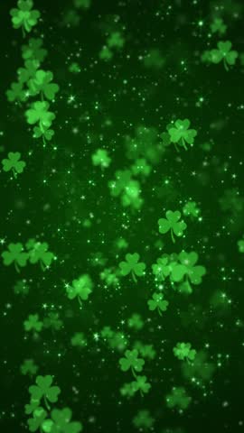 Vertical video - lucky shamrocks, shiny stars and glowing glittering particles on a dark green background. This Saint Patrick's Day celebration party background animation is full HD and looping. Royalty-Free Stock Footage #3444522053