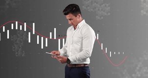 Animation of financial data processing over caucasian businessman using tablet. Global finance, business, connections, computing and data processing concept digitally generated video.