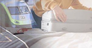 Animation of caucasian woman closing suitcase in bedroom over train at station. Free time, vacations, travel, preparation and lifestyle, digitally generated video.