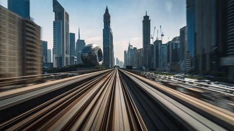 Motion timelapse POV shot from modern Dubai Elevated Metro System running alongside the Sheikh Zayed Road in Dubai, United Arab Emirates (UAE). Arkivvideo